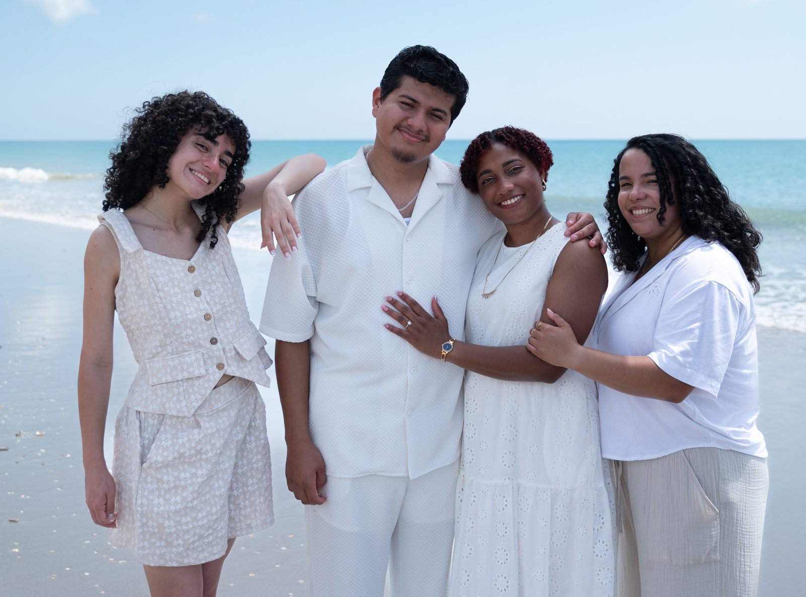 Josue and Yassiel with friends on the beach